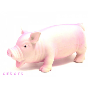 latex dog toy in the shape of a pink pig